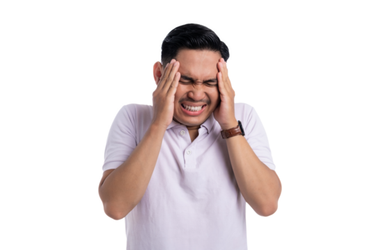 Frustrated young man holding head with painful expression suffering from headache or stress isolated on transparent background