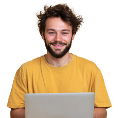 A man with a beard and a yellow shirt is smiling and holding a laptop