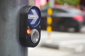 Pedestrian crossing button near traffic signal