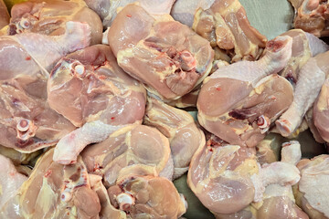 Raw Chicken Leg Quarters on Display at Market Stall