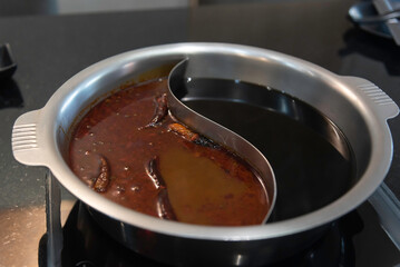 shabu-shabu or sukiyaki. Beef slice on top of hot pot, Fresh beef slices with ingredients background for Japanese shabu-shabu or Sukiyaki.