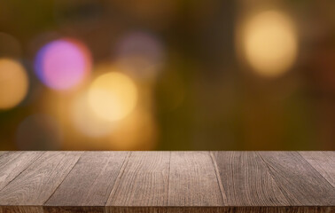 Empty wood table top and blur of restaurant background selective focus product display