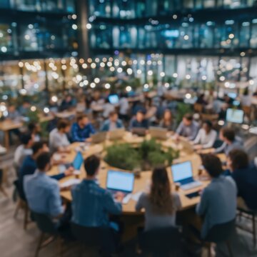 Team meeting in modern office with laptops and discussion.