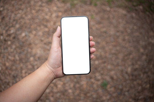 Smart phone mockup. Women hands holding cell telephone blank copy space screen smartphone blank white screen isolated technology concept.