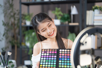 beauty blogger Young Asian girl makeup artist Professional Woman blogger vlogger is showing...