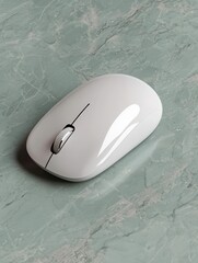Sleek white wireless mouse on a marble surface.