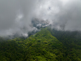 Clouds over the mountain slopes with rainforest in Camiguin Island. Philippines. view from above.