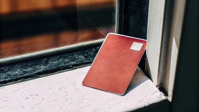 Close Up Red ATM Card Banking Detail Macro Natural Lighting Suitable for Financial Identity Concepts