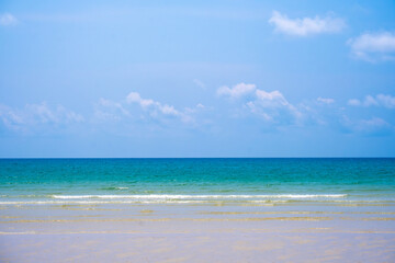 Nature of the ocean and blue sky Summer with sunshine, sandy beaches, clear blue waters sparkling against the blue sky. on an island with good ecology and environment Background for summer vacation