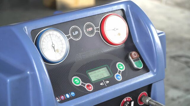 Car air conditioning system technician,fill car air conditioner,Servicing car air conditioner. Service station. Car repair.