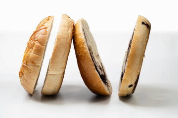Closeup view of slices of bagel bread isolated over a white background