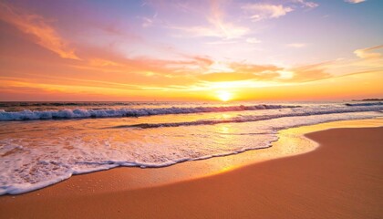 Obraz premium Golden sunset hues paint the sky over the tranquil sea, with gentle waves lapping the sandy beach as dusk settles on the horizon