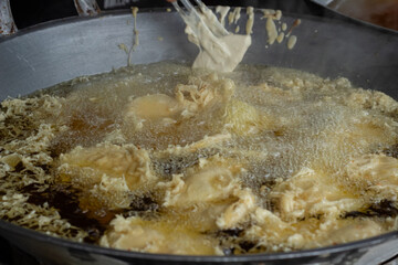Process of frying bananas, cooked in hot oil