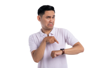 Young man pointing at wristwatch with impatient facial expression isolated on transparent background