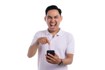 Excited young man shouting and pointing at smartphone screen in surprise isolated on transparent background