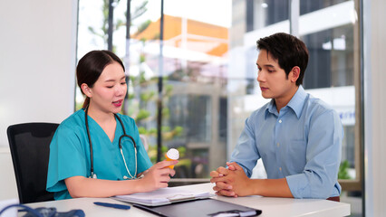 Doctor's Consultation: A compassionate healthcare professional, in scrubs, consults with a male...