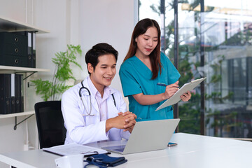 Healthcare Collaboration: Two medical professionals, a doctor and a nurse, are shown engaging in a productive discussion in a modern office setting.