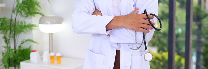Adult Asian doctor in white coat with stethoscope medical expertise diagnosis consultation wellness and healthcare promoting trust and confidence for patients