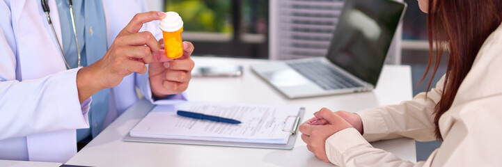 Medical Consultation: A doctor offers medication advice and prescription to patient, showcasing the...
