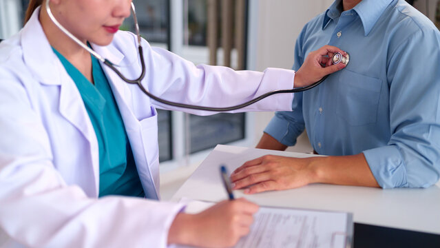 Patient Checkup: A compassionate doctor uses a stethoscope to examine a patient's heart and lungs during a routine checkup, symbolizing healthcare and well-being.