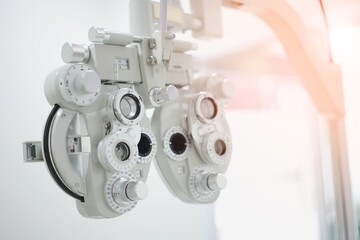 Phoropter for eye test, lenses glasses for eye check in optical store, health care, eye care concept, industry eye care. old film projector