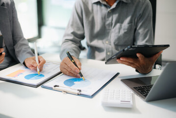 Two young businesswomen working new start up project Laptop computer and digital tablet and smart phone