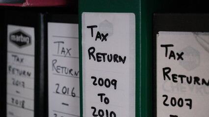 Tax return folder maps are grouped by year.