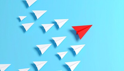 Unique red paper airplane distinctively positioned among white paper airplanes on a blue background symbolizing individuality