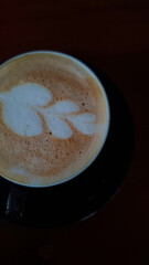 cup of coffee latte on the wooden table