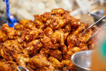 lose-Up View of Crispy Fried Chicken Drumsticks at street food in Thailand
