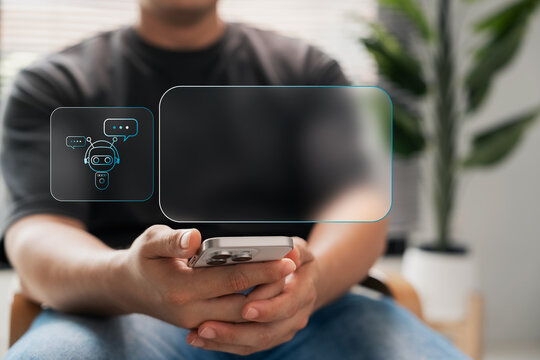 AI chatbot communication on smartphone. Person holding mobile device with virtual assistant and chat interface, representing customer service, automation, and smart response system.