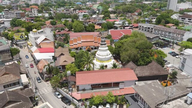 Buddhist Temple Stupa Of Wat Ket Karam Along Charoenrad Road, Muang, Chiang Mai, Thailand. Aerial Drone Shot