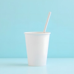Cold milk drink in a glass with a straw, isolated on white