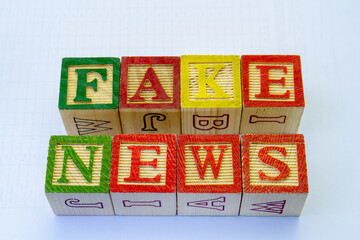 The term fake news visually displayed on a clear background with copy space