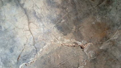 Grunge concrete texture with distressed weathered stone surface, aged wall background with rough cement patterns and abstract industrial texture design element