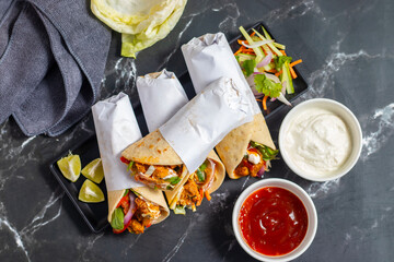 Chicken shawarma roll is a Middle Eastern wrap made with spiced grilled chicken, garlic sauce,...