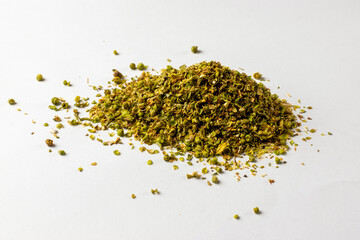 Dried crushed oregano - white background