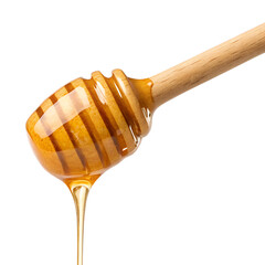 honey dripping from wooden spoon Isolated on transparent background