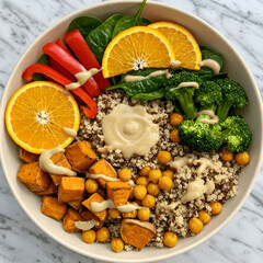Vibrant Vegan Buddha Bowl with Quinoa, Roasted Sweet Potatoes, and Tahini Dressing.