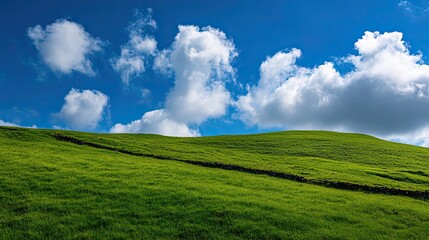 Green Hillside with Clouds and Stone Wall in Ireland