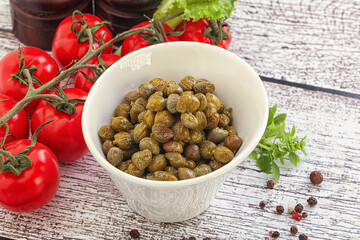 Marinated green capers in the bowl