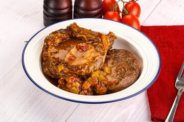 Italian cuisine - ossobuco with sauce