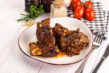 Prepared tasty beef ribs with sauce