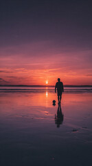 Fototapeta premium Silhouette of a person with a ball on a beach at sunset with a colorful sky reflecting on the water