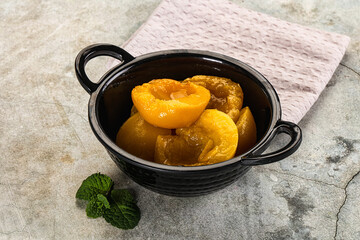 Canned marinated peach in syrop