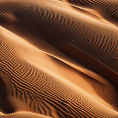 Abstract patterns of rippling golden desert sand dunes under harsh shadows at sunset