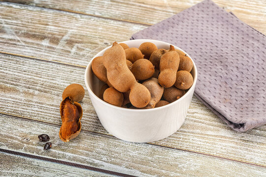 Tropical exotic Tamarind fruit heap