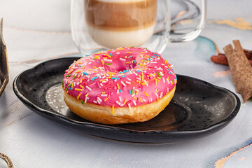Sweet donut with strawberry icing