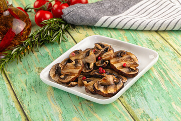 Tasty hot grilled champignon mushrooms