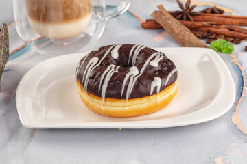Delicous sweet donut with chocolate glaze